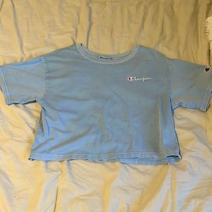 light blue champion crop top slight stain on the front of the shirt